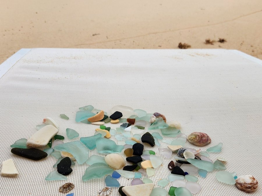 Assorted sea glass pieces in soft coastal tones